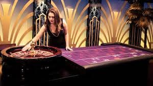 Live dealer revealing Dragon Tiger cards at hongtogel login studio